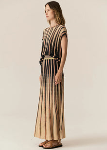  POL - TEDD KNIT SKIRT
The Tedd Knit Skirt combines our signature knitted pleat detailing with pointelle stitch, and a stunning intarsia pattern in three key colourways.
-Striped elasticised waistband - pull on style.-Half lining.-Spiked intarsia detailing from the hem up.-Vertical two tone stripe detailing separates pointelle stitch and jersey intarsia knit panels to create a multi-textured look you won't find anywhere else.-Midi length, a-line 