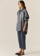 POL CASSIS FISH SHIRT
-Classic shirt collar.
-Button closure through the centre front.
-Gathered detail from yoke at the centre back.
-In-house designed placement fish print on either side at the front.
-Full length sleeves.
-Gathers at the cuffs - two button closure.
-Oversized fit through the body - longline silhouette.
-Hem curves down at the centre back.
-A-line shape.
-Available in Denim/Pebble and Natural/Berry.
100% COTTON