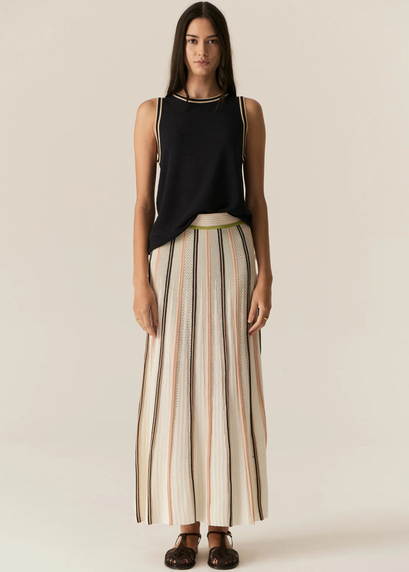  POL - TEDD KNIT SKIRT
The Tedd Knit Skirt combines our signature knitted pleat detailing with pointelle stitch, and a stunning intarsia pattern in three key colourways.
-Striped elasticised waistband - pull on style.-Half lining.-Spiked intarsia detailing from the hem up.-Vertical two tone stripe detailing separates pointelle stitch and jersey intarsia knit panels to create a multi-textured look you won't find anywhere else.-Midi length, a-line 