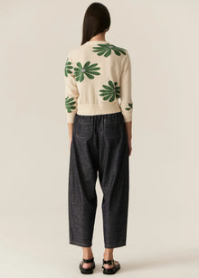 POL | LASK DAISY CARDI
-Round, ribbed neckline.
-Matching button closure through the centre front.
-Soft lightweight cotton yarn - perfect for layering in Spring.
-Intarsia Daisy detail - petals in cotton, centre in lurex yarn.
-Full length sleeves - deep ribbed cuffs.
-Regular fit through the body.
-Deep ribbed hem.
-Marisa is 179cm tall and a size 8, wearing a size S in all colours.
-Approximate length in cm by size: XS/52cm, S/53cm, M/54cm, L/55cm, XL/56cm.
-97% Cotton / 3% Metallic.