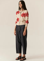 POL | LASK DAISY CARDI
-Round, ribbed neckline.
-Matching button closure through the centre front.
-Soft lightweight cotton yarn - perfect for layering in Spring.
-Intarsia Daisy detail - petals in cotton, centre in lurex yarn.
-Full length sleeves - deep ribbed cuffs.
-Regular fit through the body.
-Deep ribbed hem.
-Marisa is 179cm tall and a size 8, wearing a size S in all colours.
-Approximate length in cm by size: XS/52cm, S/53cm, M/54cm, L/55cm, XL/56cm.
-97% Cotton / 3% Metallic.