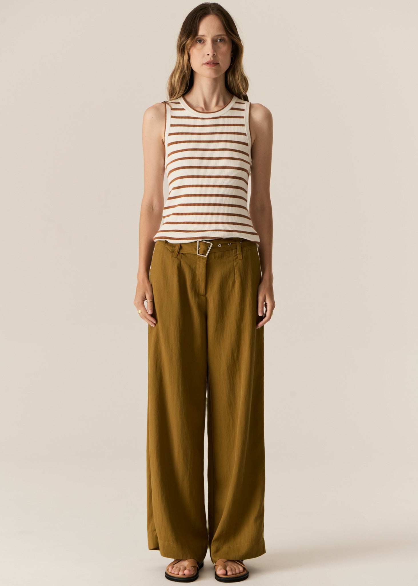 POL -  LUCA TANK
Made from a ribbed viscose and cotton blend yarn, the Luca Knit Tank is super soft and wearable for Spring.
-Round neckline - ribbed with contrast striped edge.
-Sleeveless design - armholes are ribbed with contrast striped edge.
-Body skimming fit - ribbed style has a nice amount of stretch.
-Available in White/Camel and White/Ink