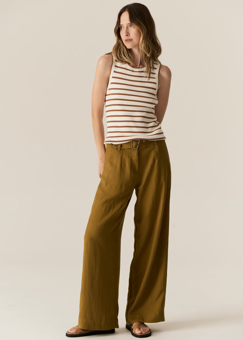 POL -  LUCA TANK
Made from a ribbed viscose and cotton blend yarn, the Luca Knit Tank is super soft and wearable for Spring.
-Round neckline - ribbed with contrast striped edge.
-Sleeveless design - armholes are ribbed with contrast striped edge.
-Body skimming fit - ribbed style has a nice amount of stretch.
-Available in White/Camel and White/Ink