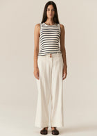 POL -  LUCA TANK
Made from a ribbed viscose and cotton blend yarn, the Luca Knit Tank is super soft and wearable for Spring.
-Round neckline - ribbed with contrast striped edge.
-Sleeveless design - armholes are ribbed with contrast striped edge.
-Body skimming fit - ribbed style has a nice amount of stretch.
-Available in White/Camel and White/Ink