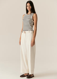 POL -  LUCA TANK
Made from a ribbed viscose and cotton blend yarn, the Luca Knit Tank is super soft and wearable for Spring.
-Round neckline - ribbed with contrast striped edge.
-Sleeveless design - armholes are ribbed with contrast striped edge.
-Body skimming fit - ribbed style has a nice amount of stretch.
-Available in White/Camel and White/Ink