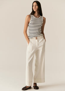 POL -  LUCA TANK
Made from a ribbed viscose and cotton blend yarn, the Luca Knit Tank is super soft and wearable for Spring.
-Round neckline - ribbed with contrast striped edge.
-Sleeveless design - armholes are ribbed with contrast striped edge.
-Body skimming fit - ribbed style has a nice amount of stretch.
-Available in White/Camel and White/Ink