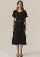 POL - FAIRE BELTED DRESS
Made from a drapey soft suiting, the Faire Belted Dress is an elevated everyday style that can be dressed up or down.
-Slash neckline.
-Short sleeves.
-Relaxed fit can be cinched in with the matching belt.
-Feature nickel buckle on the belt.
-Hip pockets.
-A-line midi length skirt.
-Topstitch detailing throughout.
-Available in Black &amp; Khaki&nbsp;
-Fabric has a natural crinkle texture.