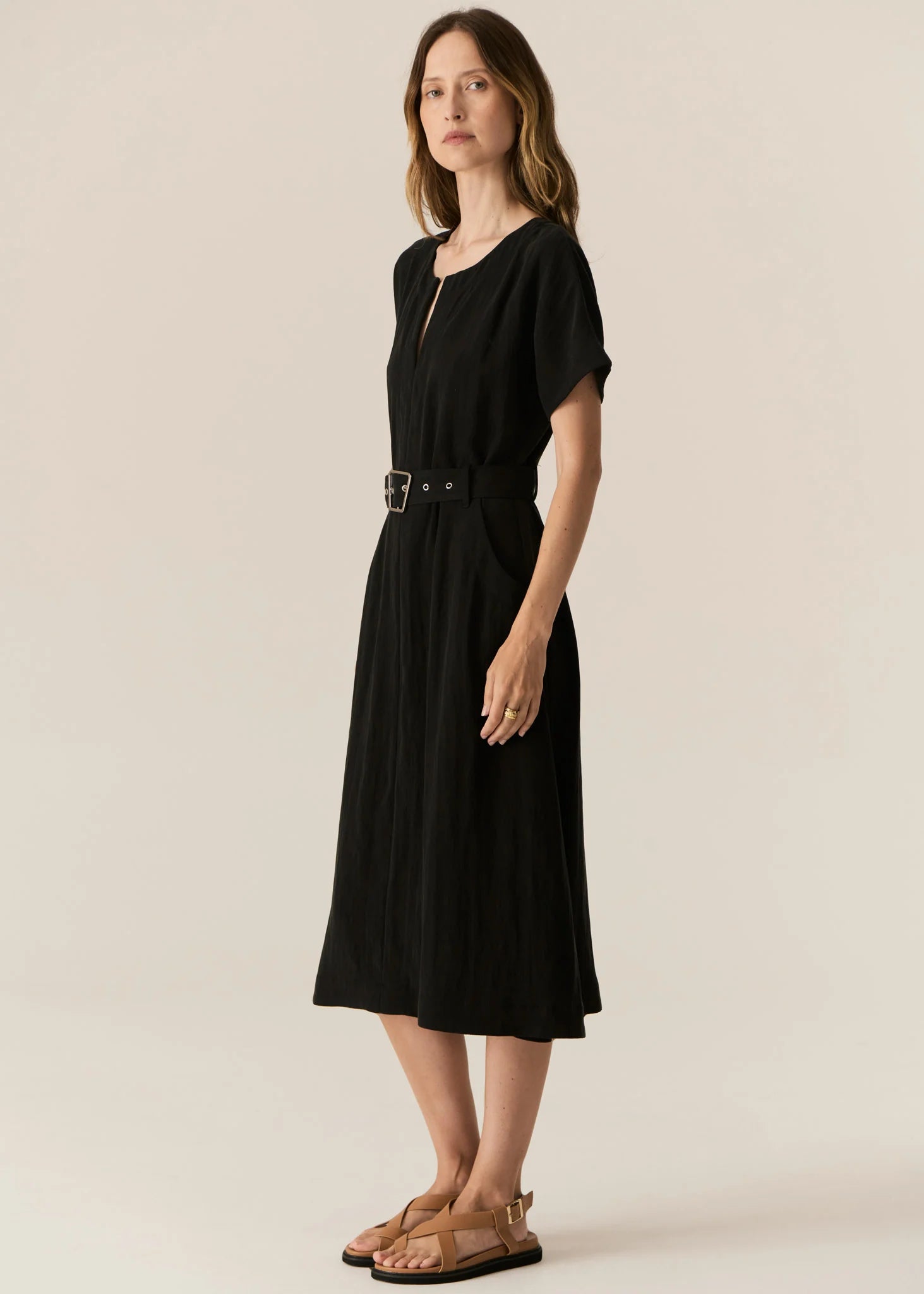 FAIRE BELTED DRESS

Made from a drapey soft suiting, the Faire Belted Dress is an elevated everyday style that can be dressed up or down.
-Slash neckline.
-Short sleeves.
-Relaxed fit can be cinched in with the matching belt.
-Feature nickel buckle on the belt.
-Hip pockets.
-A-line midi length skirt.
-Topstitch detailing throughout.
-Available in Black &amp; Khaki&nbsp;
-Fabric has a natural crinkle texture.