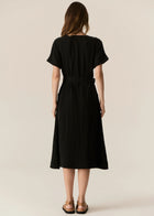 FAIRE BELTED DRESS

Made from a drapey soft suiting, the Faire Belted Dress is an elevated everyday style that can be dressed up or down.
-Slash neckline.
-Short sleeves.
-Relaxed fit can be cinched in with the matching belt.
-Feature nickel buckle on the belt.
-Hip pockets.
-A-line midi length skirt.
-Topstitch detailing throughout.
-Available in Black &amp; Khaki&nbsp;
-Fabric has a natural crinkle texture.