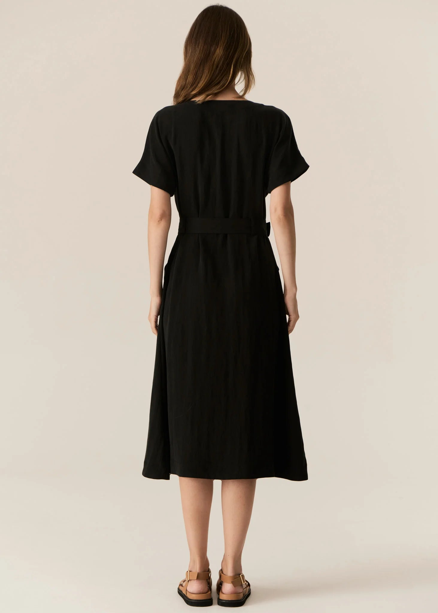 FAIRE BELTED DRESS

Made from a drapey soft suiting, the Faire Belted Dress is an elevated everyday style that can be dressed up or down.
-Slash neckline.
-Short sleeves.
-Relaxed fit can be cinched in with the matching belt.
-Feature nickel buckle on the belt.
-Hip pockets.
-A-line midi length skirt.
-Topstitch detailing throughout.
-Available in Black &amp; Khaki&nbsp;
-Fabric has a natural crinkle texture.