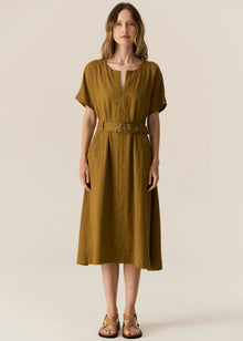 FAIRE BELTED DRESS

Made from a drapey soft suiting, the Faire Belted Dress is an elevated everyday style that can be dressed up or down.
-Slash neckline.
-Short sleeves.
-Relaxed fit can be cinched in with the matching belt.
-Feature nickel buckle on the belt.
-Hip pockets.
-A-line midi length skirt.
-Topstitch detailing throughout.
-Available in Black &amp; Khaki&nbsp;
-Fabric has a natural crinkle texture.