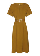 FAIRE BELTED DRESS

Made from a drapey soft suiting, the Faire Belted Dress is an elevated everyday style that can be dressed up or down.
-Slash neckline.
-Short sleeves.
-Relaxed fit can be cinched in with the matching belt.
-Feature nickel buckle on the belt.
-Hip pockets.
-A-line midi length skirt.
-Topstitch detailing throughout.
-Available in Black &amp; Khaki&nbsp;
-Fabric has a natural crinkle texture.