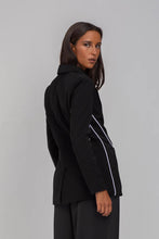 Load image into Gallery viewer, BLAK LUXE

Indulge in the luxury of our Pipe Dream Blazer - Black with White Piping. This monochromatic masterpiece, crafted from a blend of Polyester and Nylon, boasts a sophisticated, tailored fit.
