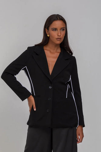 BLAK LUXE

Indulge in the luxury of our Pipe Dream Blazer - Black with White Piping. This monochromatic masterpiece, crafted from a blend of Polyester and Nylon, boasts a sophisticated, tailored fit.