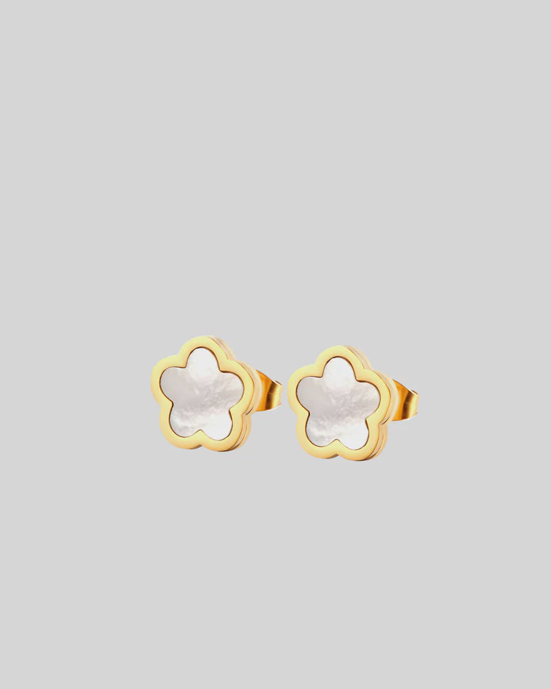 CASTEL & CO | POPPY STUD
Fresh, feminine, and effortlessly cool. The Poppy Studs in white bring a soft pop of polish to your everyday look. Crafted from gold-plated stainless steel, they’re waterproof, hypoallergenic, and gentle on the ears. With a classic stud closure and delicate floral shape, they’re made to be worn on their own – simple, elegant, and easy to love.

Main material: gold plating, stainless steel
Closure type: stud
Earrings size: 1,3 х 1,3 cm
Waterproof and hypoallergenic
Weight: 2g