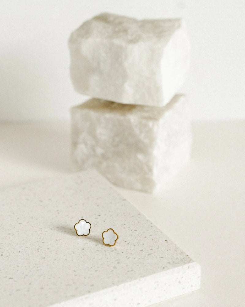 CASTEL & CO | POPPY STUD
Fresh, feminine, and effortlessly cool. The Poppy Studs in white bring a soft pop of polish to your everyday look. Crafted from gold-plated stainless steel, they’re waterproof, hypoallergenic, and gentle on the ears. With a classic stud closure and delicate floral shape, they’re made to be worn on their own – simple, elegant, and easy to love.

Main material: gold plating, stainless steel
Closure type: stud
Earrings size: 1,3 х 1,3 cm
Waterproof and hypoallergenic
Weight: 2g