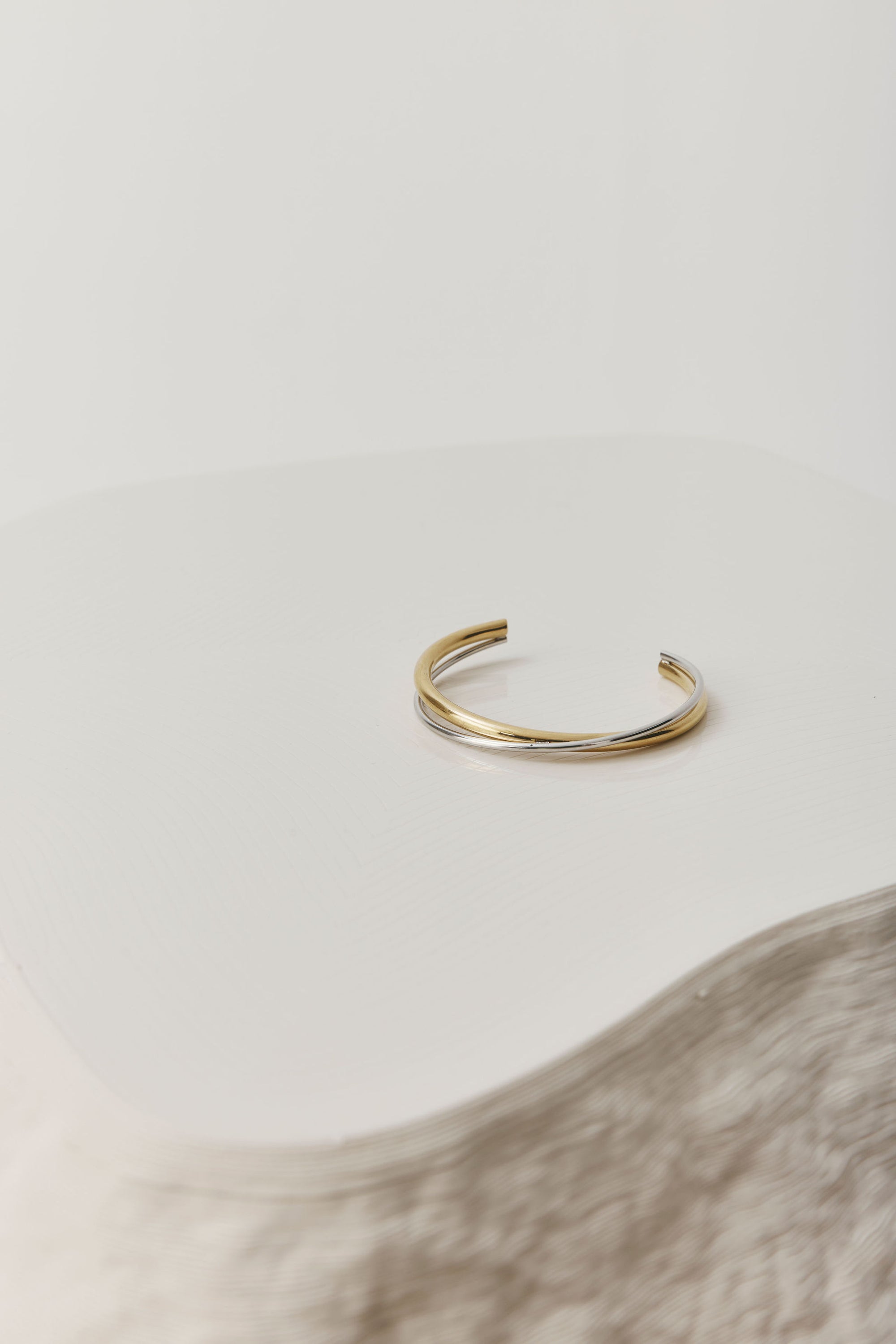 Gold open cuff bracelet with a sleek, sculptural design. The Castel & Co Quinn Cuff is crafted from gold-plated stainless steel with a smooth, polished finish and an easy open fit, ideal for larger wrists. Waterproof, hypoallergenic, and designed for comfortable everyday wear.
