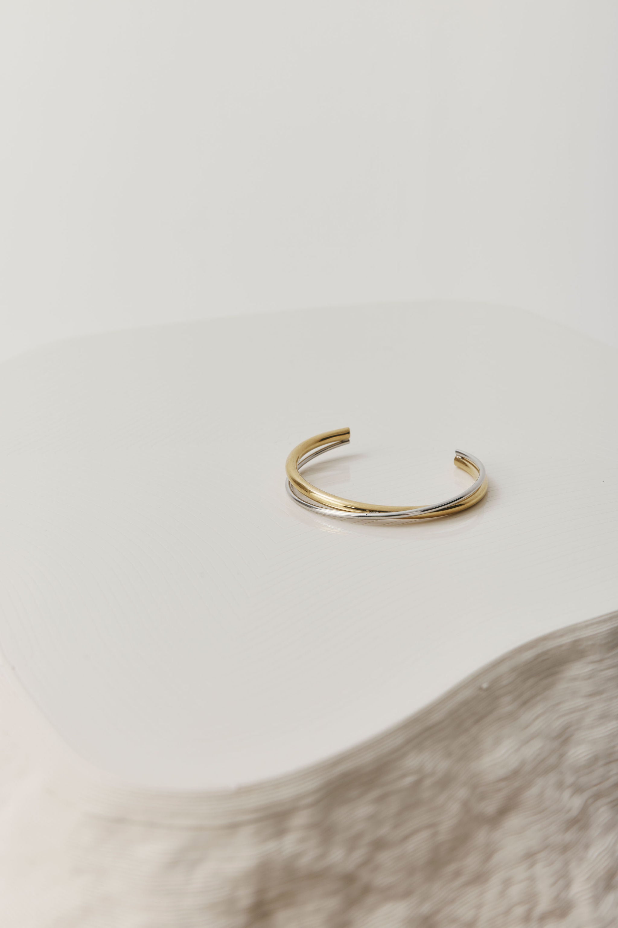 Gold open cuff bracelet with a sleek, sculptural design. The Castel & Co Quinn Cuff is crafted from gold-plated stainless steel with a smooth, polished finish and an easy open fit, ideal for larger wrists. Waterproof, hypoallergenic, and designed for comfortable everyday wear.