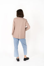 The Cosmo Blazer will instantly add effortless sophistication to any outfit! Lightweight enough to not feel heavy or restrictive but will still provide that extra layer of warmth. We love wearing her with jeans and a white tee for a chic weekend look, or pair with a pant or skirt to create a classic suit for days in the office.

Smart casual blazer with a soft, boxy silhouette.
Small subtle shoulder pads.
Lined collar with fold back lapel.
Lightweight, soft, stretch fabric with beautiful drape.
Functional p