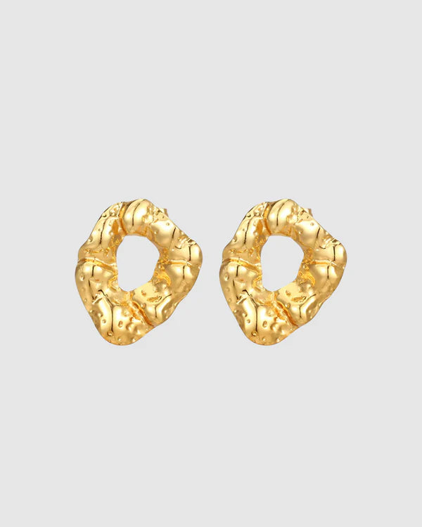 Modern and sculptural, the Castel & Co Remi Earrings in polished silver feature an open, organic form with a textured finish. Their irregular shape adds depth and edge, while the cool silver tone brings a sleek, contemporary feel. A striking statement stud that balances artistry with everyday versatility.

Material: Stainless steel
Closure Type: Stud
Earring Size: 3 x 2.4 cm
Waterproof and hypoallergenic
Weight: 8g