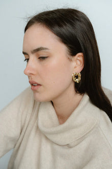 Modern and sculptural, the Castel & Co Remi Earrings in polished silver feature an open, organic form with a textured finish. Their irregular shape adds depth and edge, while the cool silver tone brings a sleek, contemporary feel. A striking statement stud that balances artistry with everyday versatility.

Material: Stainless steel
Closure Type: Stud
Earring Size: 3 x 2.4 cm
Waterproof and hypoallergenic
Weight: 8g