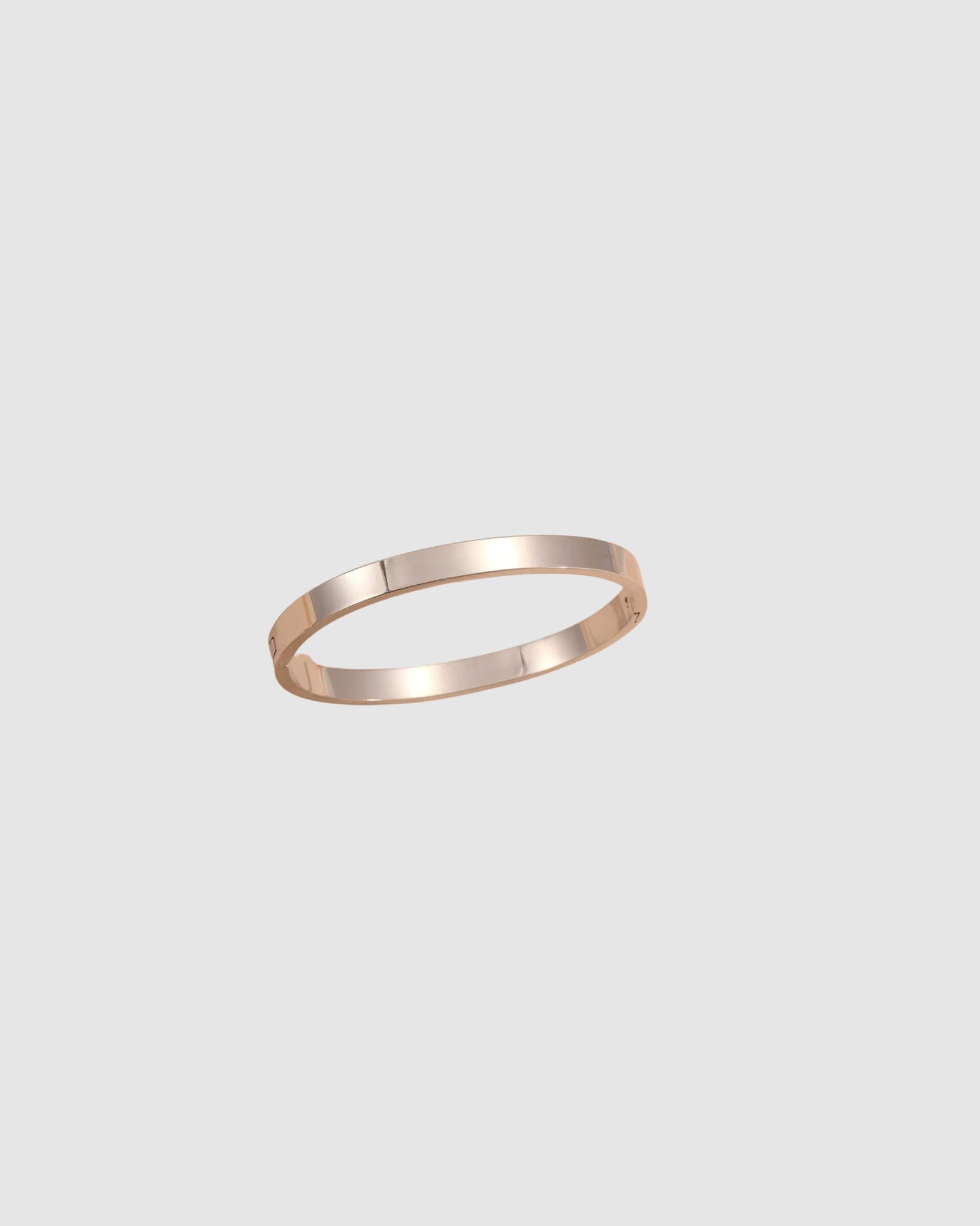 RYLEE Bracelet by Castel & Co in gold with a slim, refined silhouette designed for effortless everyday wear. Clean and modern in feel, it sits neatly on the wrist, perfect for stacking or wearing on its own. Crafted from stainless steel with gold plating, featuring a 5.8 cm diameter and 0.4 cm width. Waterproof, hypoallergenic, and lightweight at 15g.