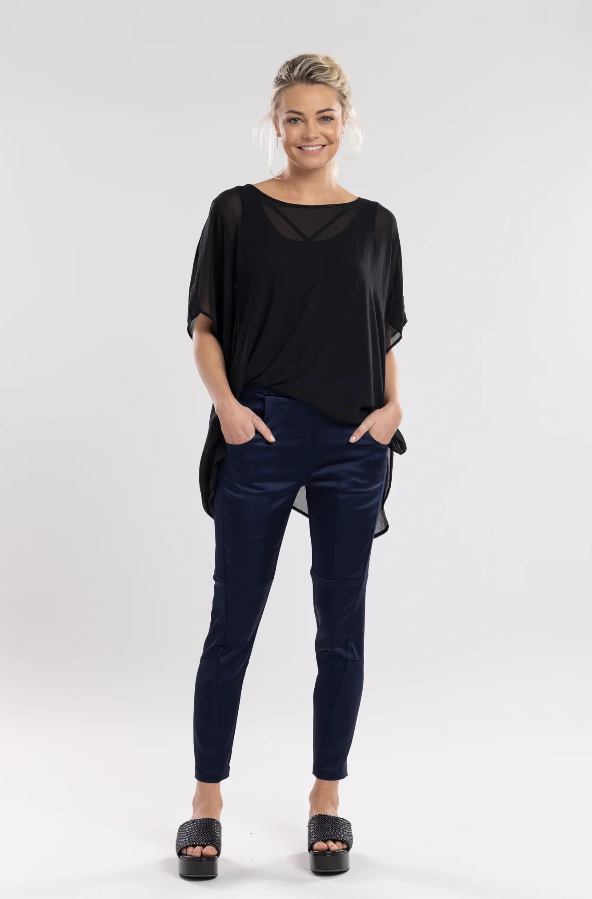 The Satin Section Pant is your go-to slightly more dressy NES essential, offering effortless style and unmatched comfort. With fabulous spliced detailing, this pant combines a sleek flat front with an elasticated back for the perfect fit. Side pockets provide practicality, while the 7/8 length and satin finish add an elevated touch to your look. Whether you're dressing up for a night out, office wear, or a special occasion, these versatile pants can easily be styled for any event. Elegant, stylish, and desi