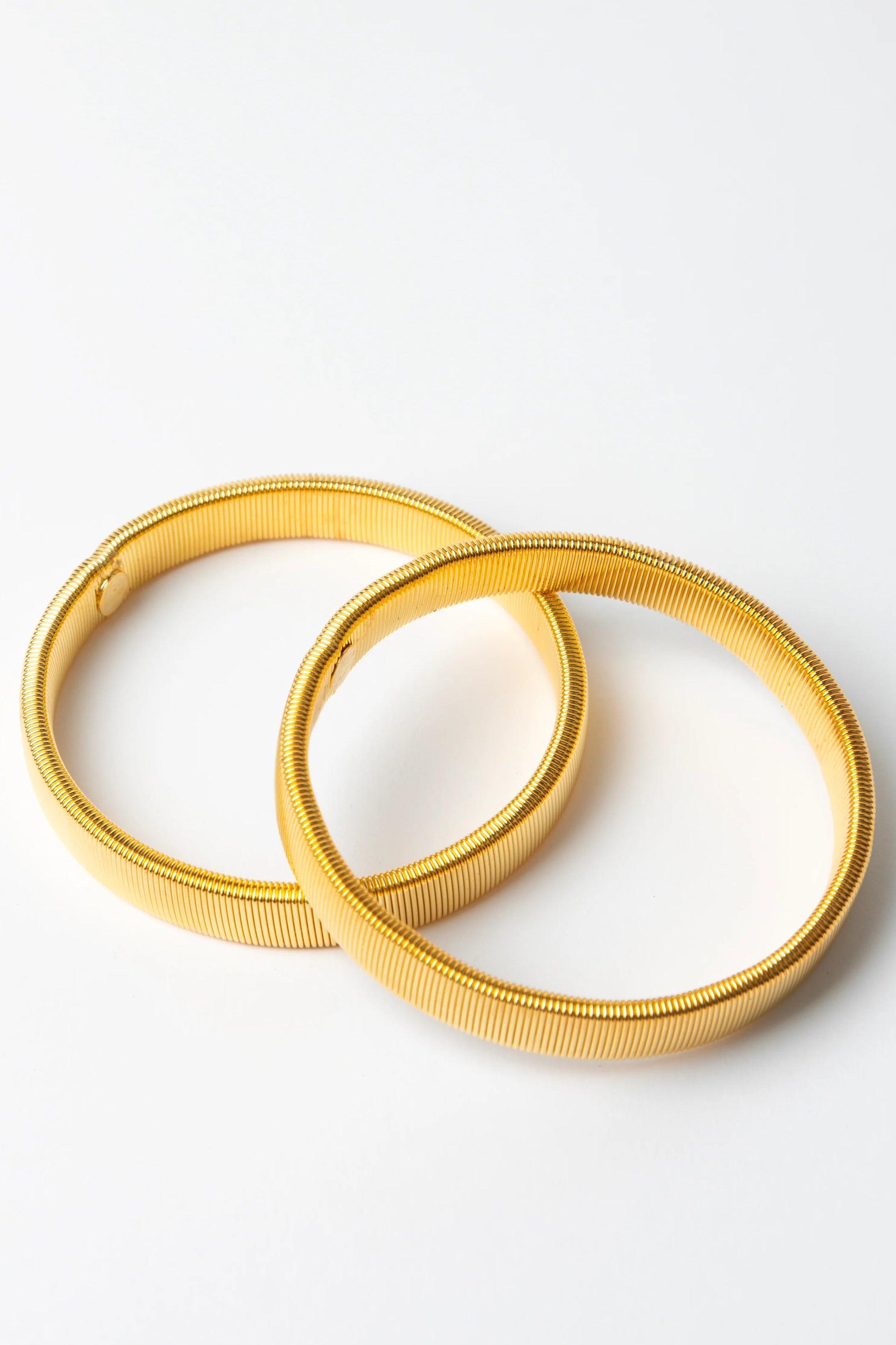 Stella + Gemma. elastic wire arm bands designed to keep your sleeves styled on your arm.

Composition: Steel Wire