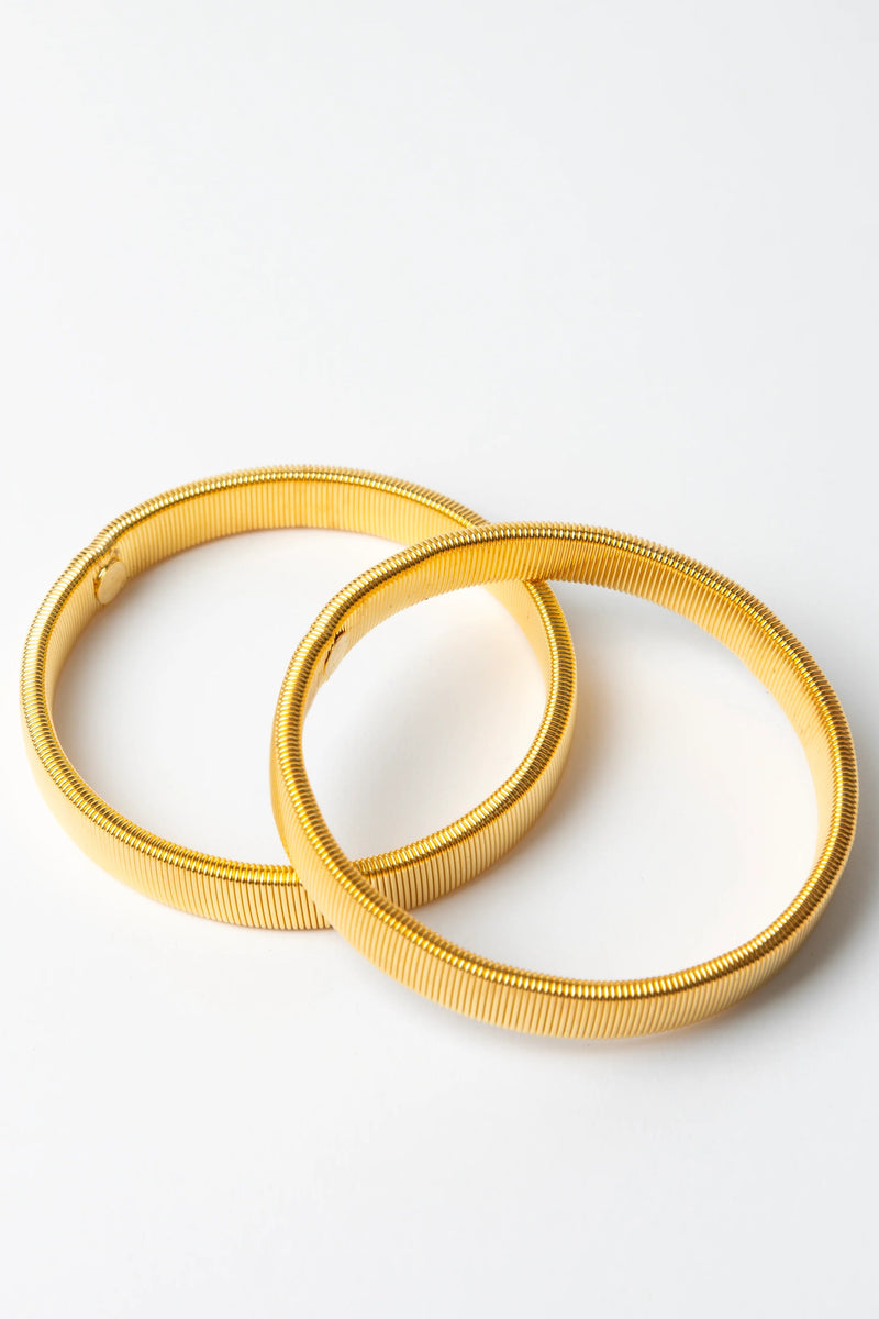 Stella + Gemma. elastic wire arm bands designed to keep your sleeves styled on your arm.

Composition: Steel Wire