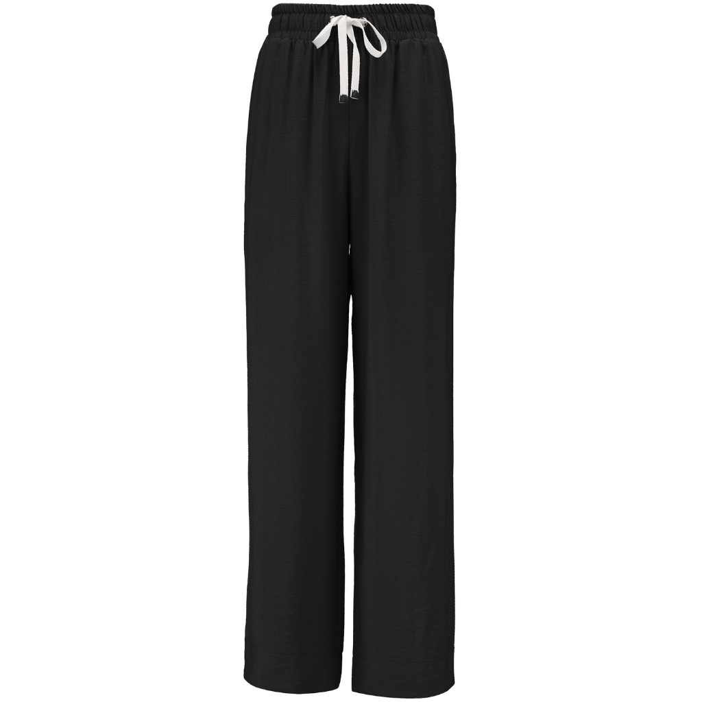 INDIANA BY MOKE
The Indiana Pants are back - and it’s no surprise they’re a top seller. Cut from a breathable viscose-nylon blend, these wide-leg pants are designed for comfort, polish, and all-day wear.
Cream contrast stripes run down each leg for a sport-luxe edge, while subtle side splits at the hem add movement and a touch of ease. The fit is streamlined yet relaxed, with a wide-leg silhouette that flatters every shape and pairs beautifully with tanks, tees, or a crisp shirt.