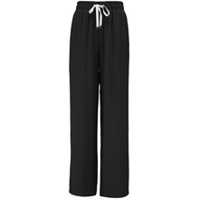 INDIANA BY MOKE
The Indiana Pants are back - and it’s no surprise they’re a top seller. Cut from a breathable viscose-nylon blend, these wide-leg pants are designed for comfort, polish, and all-day wear.
Cream contrast stripes run down each leg for a sport-luxe edge, while subtle side splits at the hem add movement and a touch of ease. The fit is streamlined yet relaxed, with a wide-leg silhouette that flatters every shape and pairs beautifully with tanks, tees, or a crisp shirt.