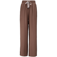 INDIANA BY MOKE
The Indiana Pants are back - and it’s no surprise they’re a top seller. Cut from a breathable viscose-nylon blend, these wide-leg pants are designed for comfort, polish, and all-day wear.
Cream contrast stripes run down each leg for a sport-luxe edge, while subtle side splits at the hem add movement and a touch of ease. The fit is streamlined yet relaxed, with a wide-leg silhouette that flatters every shape and pairs beautifully with tanks, tees, or a crisp shirt.
