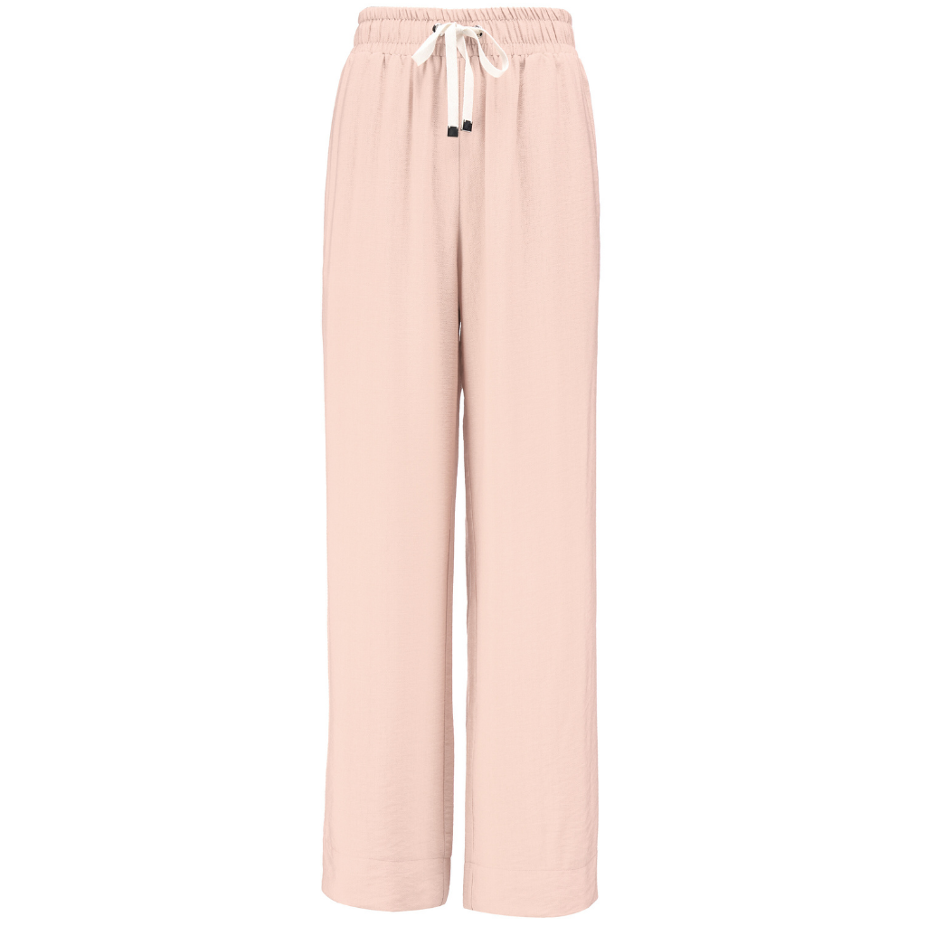 INDIANA BY MOKE
The Indiana Pants are back - and it’s no surprise they’re a top seller. Cut from a breathable viscose-nylon blend, these wide-leg pants are designed for comfort, polish, and all-day wear.
Cream contrast stripes run down each leg for a sport-luxe edge, while subtle side splits at the hem add movement and a touch of ease. The fit is streamlined yet relaxed, with a wide-leg silhouette that flatters every shape and pairs beautifully with tanks, tees, or a crisp shirt.