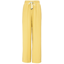 INDIANA BY MOKE
The Indiana Pants are back - and it’s no surprise they’re a top seller. Cut from a breathable viscose-nylon blend, these wide-leg pants are designed for comfort, polish, and all-day wear.
Cream contrast stripes run down each leg for a sport-luxe edge, while subtle side splits at the hem add movement and a touch of ease. The fit is streamlined yet relaxed, with a wide-leg silhouette that flatters every shape and pairs beautifully with tanks, tees, or a crisp shirt.