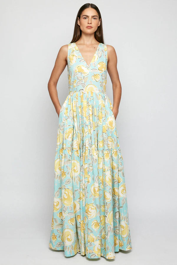  S/W/F This signature S/W/F full-bodied maxi dress features cascading layers of pleating that create graceful movement below the waist. The minimalist bodice is adorned with a soft V-neckline.