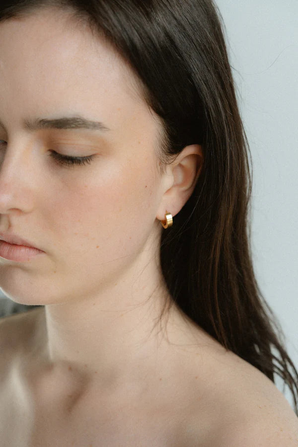 A modern take on the everyday hoop, the Castel & Co Sadie earrings feature a smaller, thicker silhouette that adds just the right amount of boldness. Available in both gold and silver, their clean, polished finish makes them an effortless staple for daily wear.

Material: Stainless steel &amp; Gold Plated
Closure Type: Congo
Earrings Size: 1.3 х 1.2 cm
Waterproof and hypoallergenic
Weight: 3g