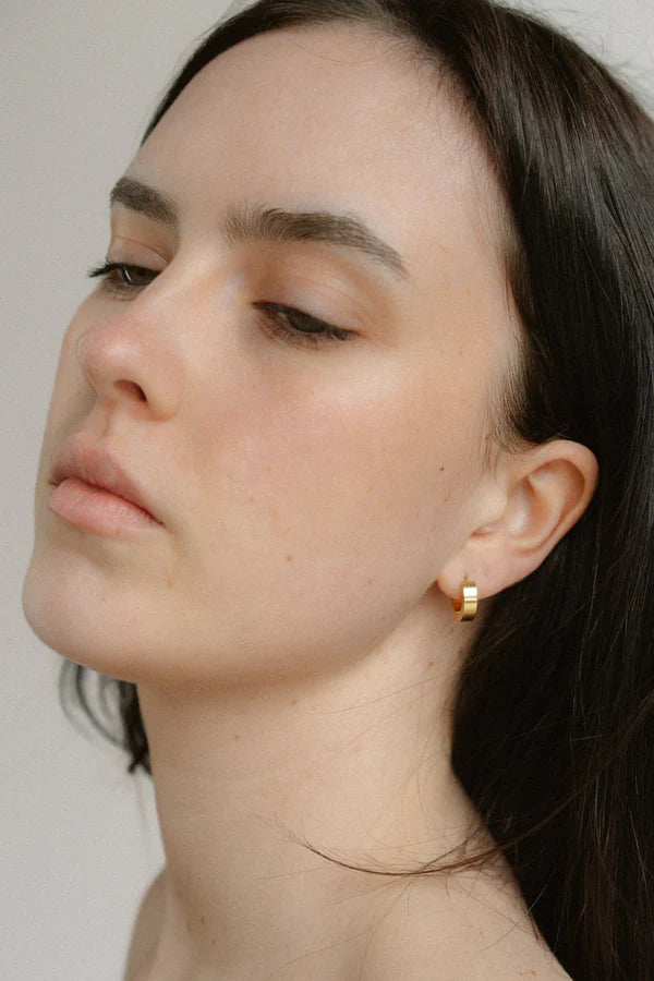 A modern take on the everyday hoop, the Castel & Co Sadie earrings feature a smaller, thicker silhouette that adds just the right amount of boldness. Available in both gold and silver, their clean, polished finish makes them an effortless staple for daily wear.

Material: Stainless steel &amp; Gold Plated
Closure Type: Congo
Earrings Size: 1.3 х 1.2 cm
Waterproof and hypoallergenic
Weight: 3g