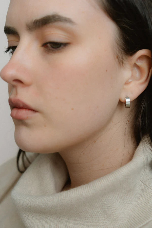 A modern take on the everyday hoop, the Castel & Co Sadie earrings feature a smaller, thicker silhouette that adds just the right amount of boldness. Available in both gold and silver, their clean, polished finish makes them an effortless staple for daily wear.

Material: Stainless steel &amp; Gold Plated
Closure Type: Congo
Earrings Size: 1.3 х 1.2 cm
Waterproof and hypoallergenic
Weight: 3g