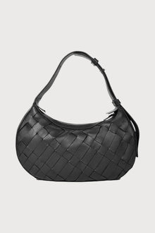 Alēo | SIENNA MINI SHOULDER BAG

Handwoven in soft pebble-grained calf leather, this mini shoulder bag blends artisanal detail with everyday ease. The adjustable strap offers versatile styling, while external and internal zip closures keep your essentials secure.

Soft handwoven box weave mini shoulder bag with adjustable strap options
Single external zip closure with internal zip closure

Dimensions
Height: 18 cm
Width: 31 cm
Depth: 10 cm

Designed in Ireland.