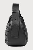 Alēo | SIENNA MINI SHOULDER BAG

Handwoven in soft pebble-grained calf leather, this mini shoulder bag blends artisanal detail with everyday ease. The adjustable strap offers versatile styling, while external and internal zip closures keep your essentials secure.

Soft handwoven box weave mini shoulder bag with adjustable strap options
Single external zip closure with internal zip closure

Dimensions
Height: 18 cm
Width: 31 cm
Depth: 10 cm

Designed in Ireland.