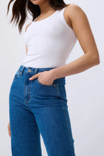 Load image into Gallery viewer, Kireina&#39;s gone with classic 5-pocket jeans style with the Skylar Wide Leg jean. With a soft denim in new 90s Blue this flattering jean delivers rock’n’roll style for everyday.

FEATURES:
- High Rise Wide Leg
- Average Inside Leg Length = 75cm
- 5-pocket Style
- Zipper fly
