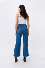 Load image into Gallery viewer, Kireina&#39;s gone with classic 5-pocket jeans style with the Skylar Wide Leg jean. With a soft denim in new 90s Blue this flattering jean delivers rock’n’roll style for everyday.

FEATURES:
- High Rise Wide Leg
- Average Inside Leg Length = 75cm
- 5-pocket Style
- Zipper fly
