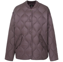 Talei by Moke lightweight quilted bomber jacket in Coco Powder, featuring a relaxed fit with ribbed collar, snap button front and curved silhouette, finished with bound edge detailing and an ultra soft velboa lining for cosy, trans seasonal layering.