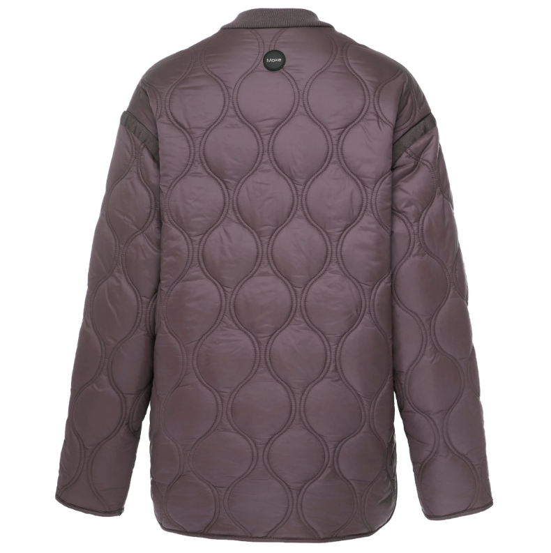 Talei by Moke lightweight quilted bomber jacket in Coco Powder, featuring a relaxed fit with ribbed collar, snap button front and curved silhouette, finished with bound edge detailing and an ultra soft velboa lining for cosy, trans seasonal layering.