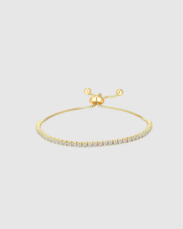 Classic sparkle, reimagined. The Castel & Co Tennis Bracelet in gold features a full row of faceted diamantés set in a sleek gold-plated finish for timeless shine. Elegant and eye-catching, it’s your go-to for adding polish to any outfit – from everyday luxe to evening glam.

Main material: stainless steel
Bracelet length: 30cm
Insert: Cubic zirconia
Waterproof and hypoallergenic
Weight: 3g