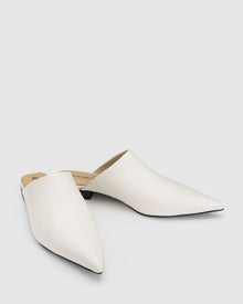 CHAOS &amp; HARMONY | VALOR MULE

Soft and clean, the VALOR MULE in Milk is crafted from recycled leather with a sleek pointed toe. This refined neutral adds a polished touch to everything from workwear to weekend denim.

Milk recycled leather pointed mule
Soft leather lined
Black stack heel / Black rubber outsole
20mm / 0.78 inch heel
Standard fit
We recommend a good leather/suede protectant to protect your shoes
Made in Dongguan, China