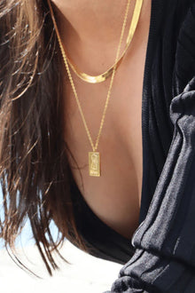 The PĀMU WAHINE NECKLACE in GOLD, long is a Bold &amp; Elegant Māori-Inspired Pendant Introducing the best selling Wahine Necklace.&nbsp; a stunning blend of boldness and delicacy. Crafted with precision, this exquisite piece features a captivating design that embodies the spirit of the modern woman. Made from 18k gold plated stainless steel, its radiant finish adds a touch of elegance to any outfit.

PĀMU jewellery is made to be worn everywhere, every day. Our pieces are water proof, sweat proof, ocean pro