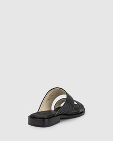 CHAOS &amp; HARMONY | WAVE SLIDE

The WAVE SLIDE in Black Snake features a subtle embossed texture that adds interest to its minimalist form. Designed as a go-to flat leather slide, it’s ideal for everyday wear — clean, easy, and comfortable from the ground up.

Black snake embossed leather slide
Soft leather lined
Black stack heel / black rubber outsole
20mm / 0.78 inch heel
Standard fit
We recommend a good leather/suede protectant to protect your shoes
Made in Dongguan, China