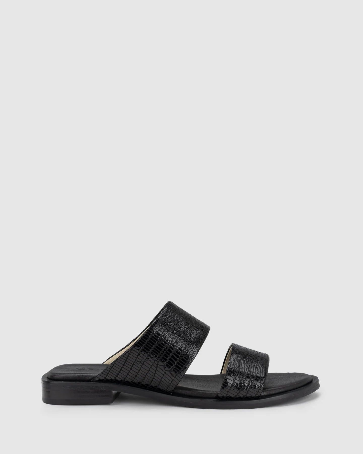 CHAOS &amp; HARMONY | WAVE SLIDE

The WAVE SLIDE in Black Snake features a subtle embossed texture that adds interest to its minimalist form. Designed as a go-to flat leather slide, it’s ideal for everyday wear — clean, easy, and comfortable from the ground up.

Black snake embossed leather slide
Soft leather lined
Black stack heel / black rubber outsole
20mm / 0.78 inch heel
Standard fit
We recommend a good leather/suede protectant to protect your shoes
Made in Dongguan, China