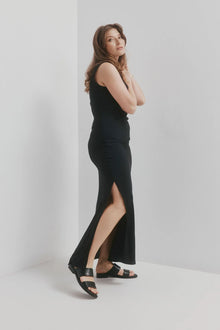 CHAOS &amp; HARMONY | WAVE SLIDE

The WAVE SLIDE in Black Snake features a subtle embossed texture that adds interest to its minimalist form. Designed as a go-to flat leather slide, it’s ideal for everyday wear — clean, easy, and comfortable from the ground up.

Black snake embossed leather slide
Soft leather lined
Black stack heel / black rubber outsole
20mm / 0.78 inch heel
Standard fit
We recommend a good leather/suede protectant to protect your shoes
Made in Dongguan, China